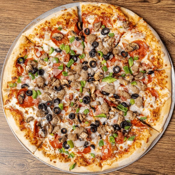 A large, sliced pizza from CD Top Shelf, topped with pepperoni, sausage, olives, mushrooms, and peppers.